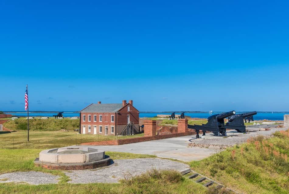 Old fort with large canons next to a beach