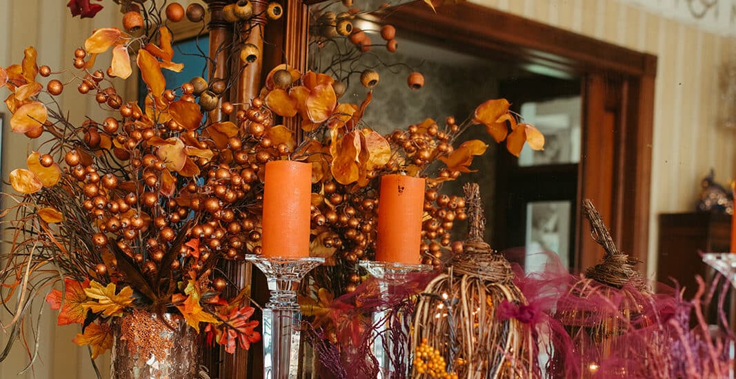 fireplace featuring Thanksgiving decor.